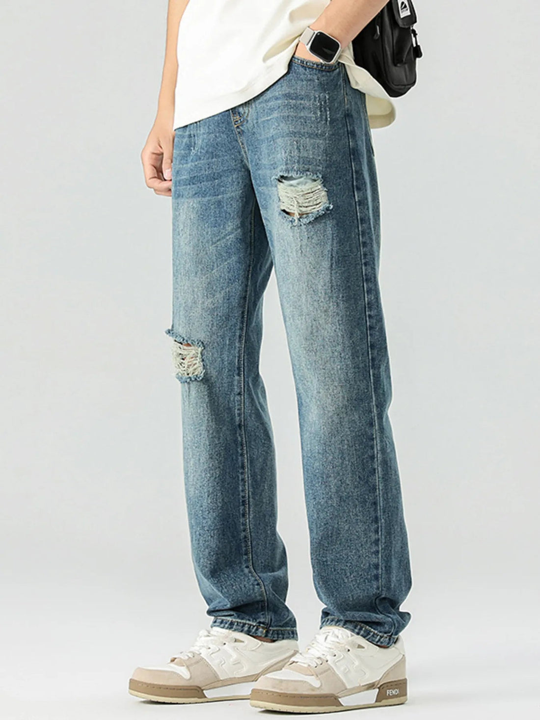 Men's Distressed Relaxed Fit Jeans designed for comfort and style at Lookzlike