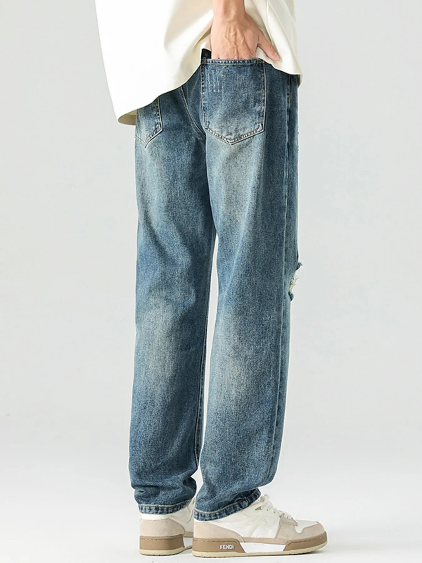 Men's Distressed Relaxed Fit Jeans designed for comfort and style at Lookzlike
