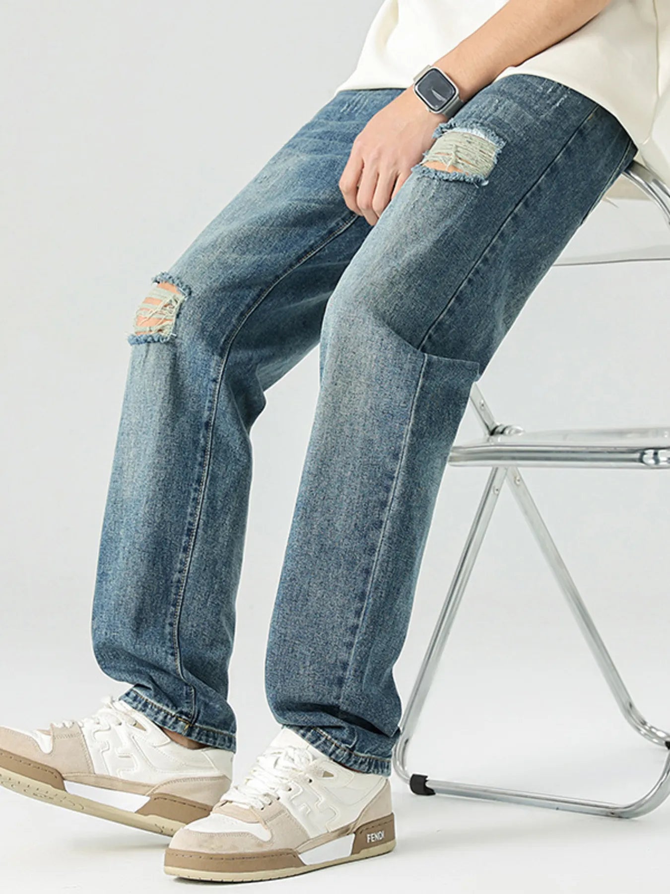 Men's Distressed Relaxed Fit Jeans designed for comfort and style at Lookzlike