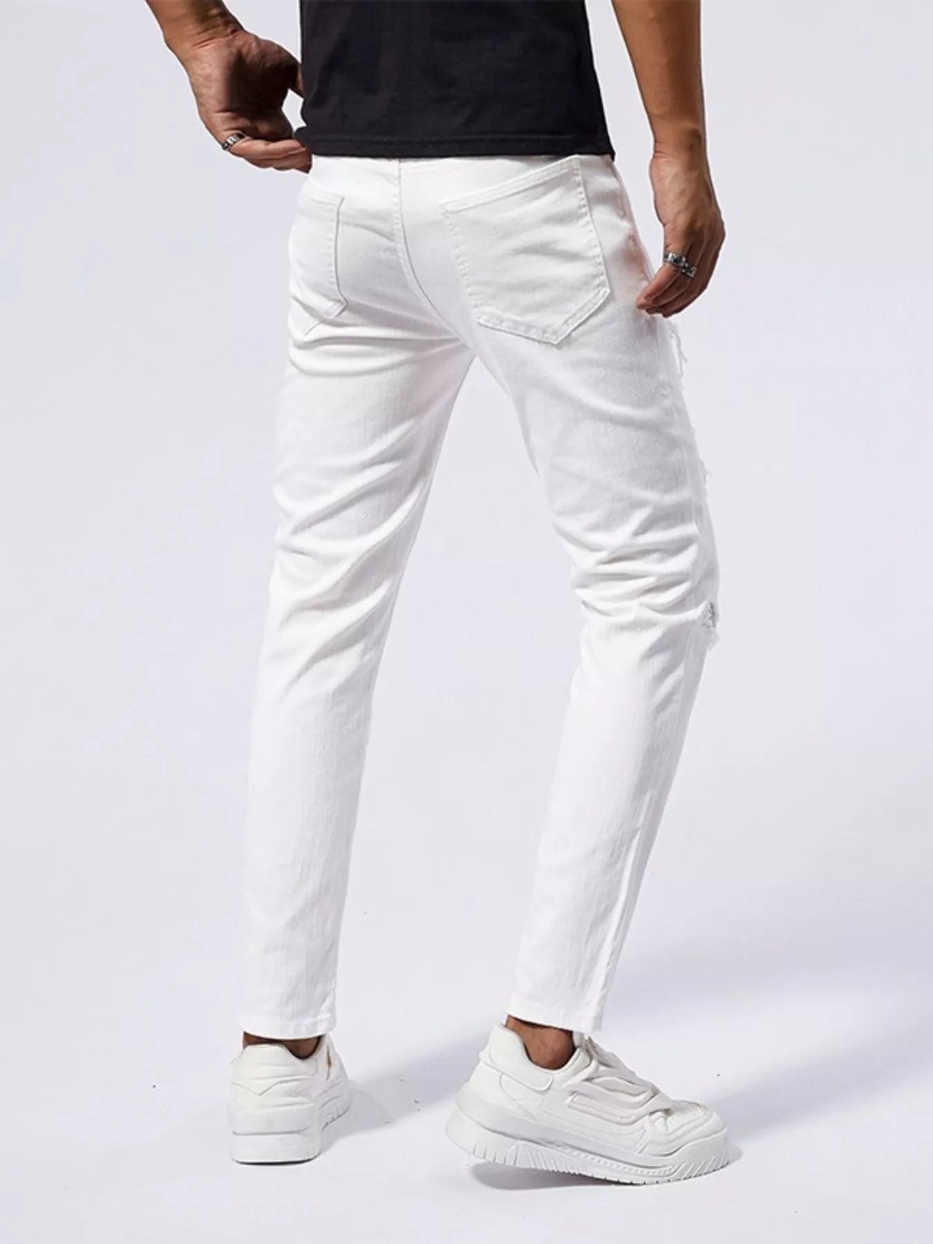 Men's Distressed Slim Fit Jeans designed for comfort and style at Lookzlike