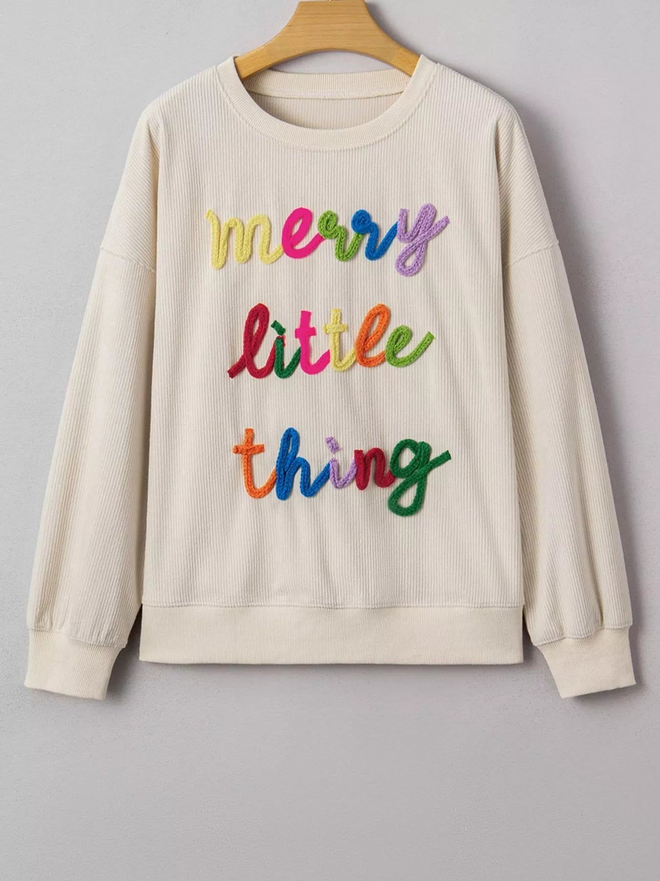 Merry Little Thing Corded Letter Graphic Ribbed Sweatshirt designed for comfort and style at Lookzlike