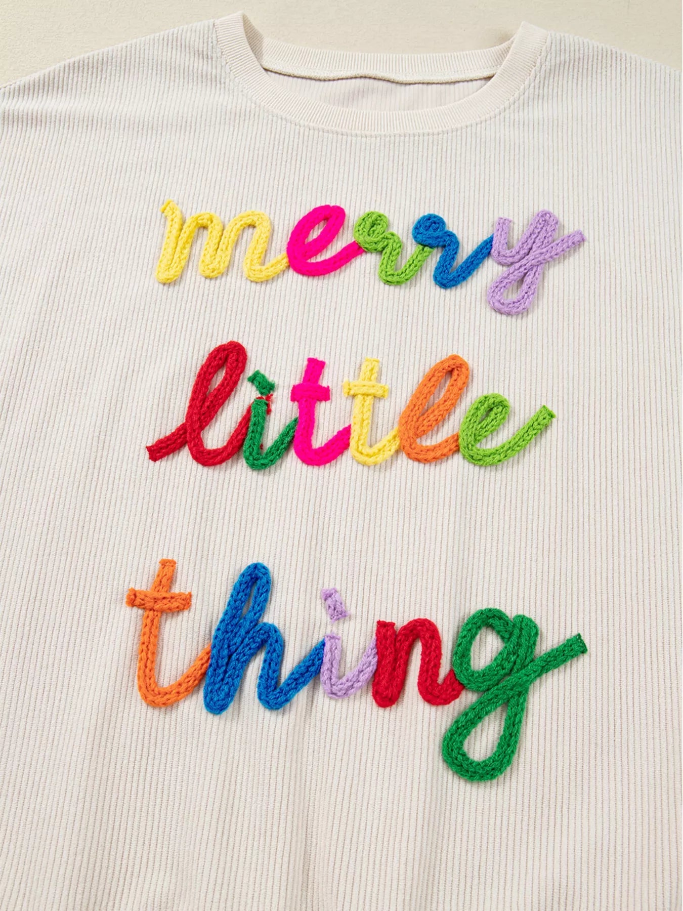 Merry Little Thing Corded Letter Graphic Ribbed Sweatshirt designed for comfort and style at Lookzlike
