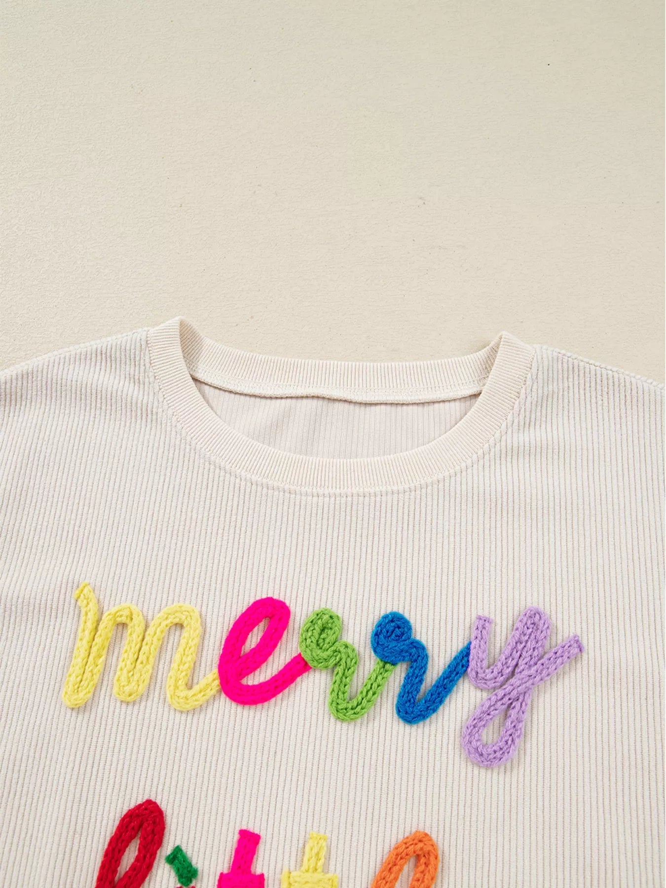 Merry Little Thing Corded Letter Graphic Ribbed Sweatshirt designed for comfort and style at Lookzlike