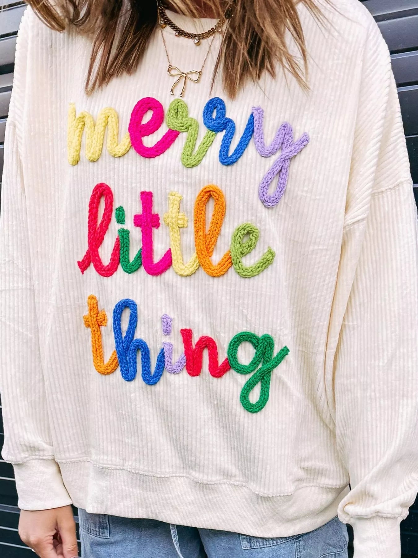 Merry Little Thing Corded Letter Graphic Ribbed Sweatshirt designed for comfort and style at Lookzlike