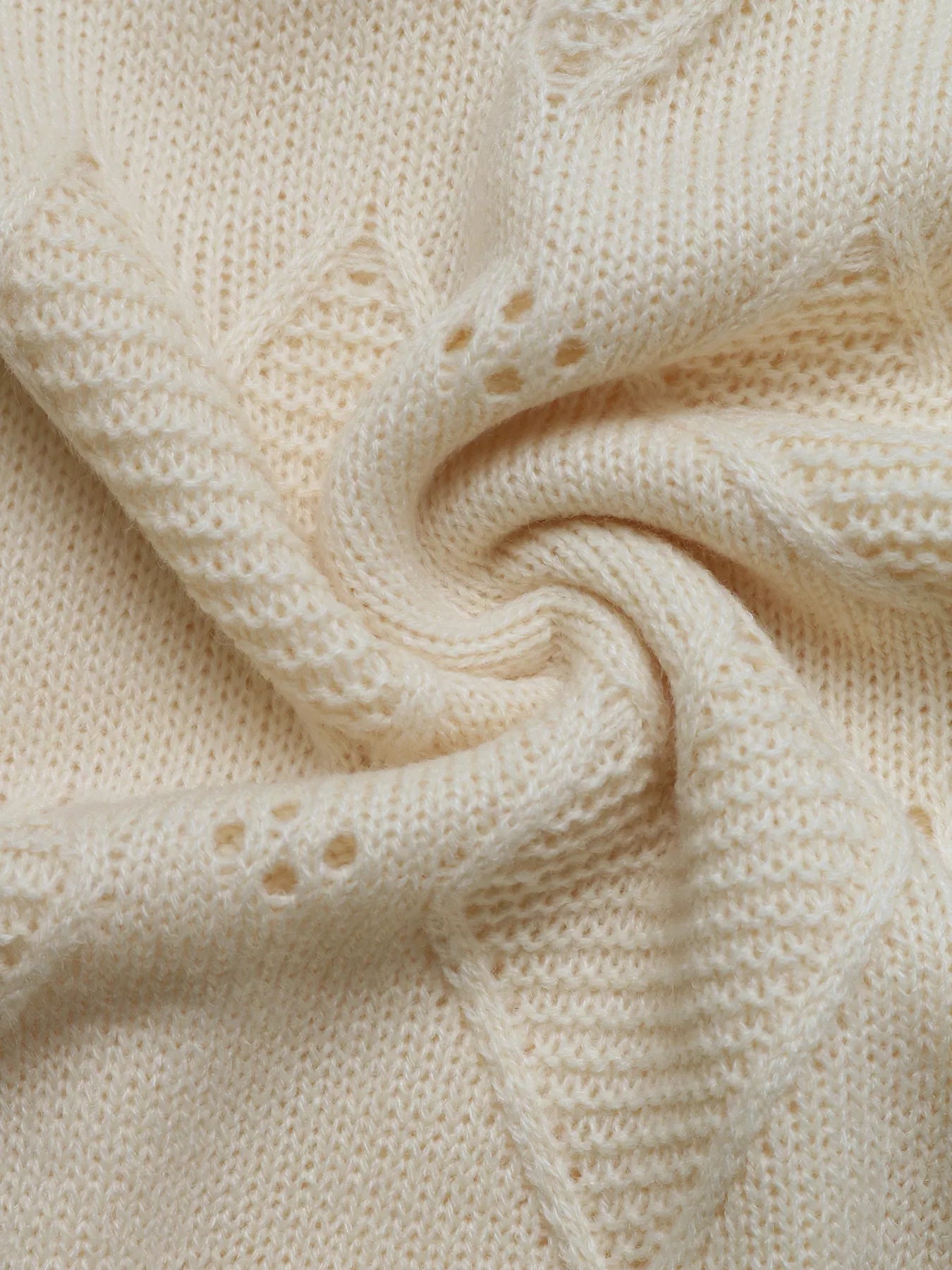 Openwork Heart Round Neck Sweater designed for comfort and style at Lookzlike