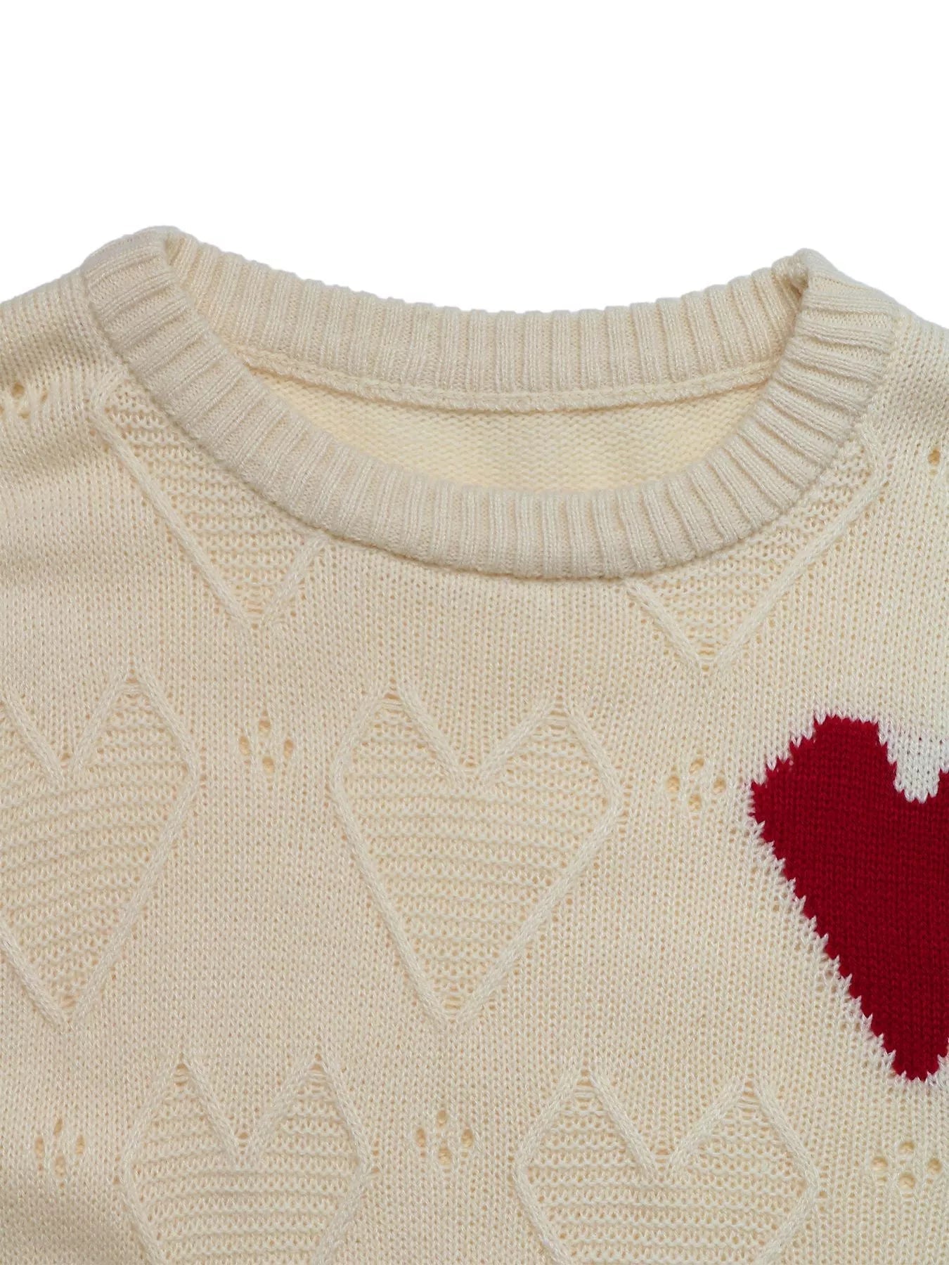 Openwork Heart Round Neck Sweater designed for comfort and style at Lookzlike
