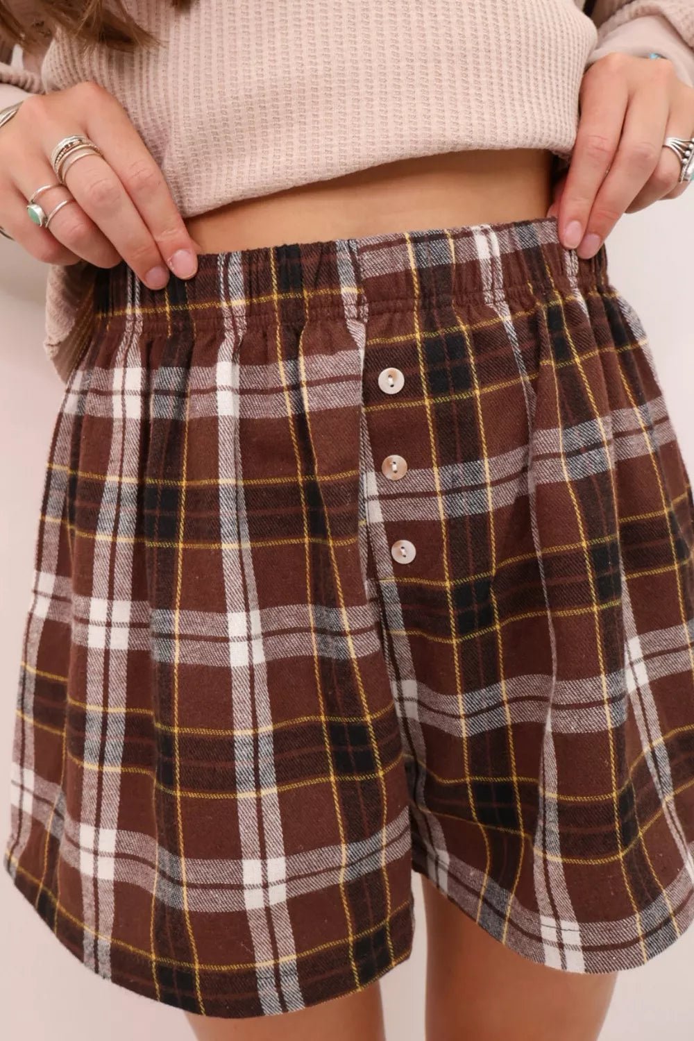 Plaid Button Front Elastic Waist Shorts designed for comfort and style at Lookzlike