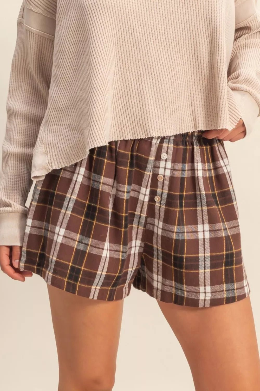 Plaid Button Front Elastic Waist Shorts designed for comfort and style at Lookzlike