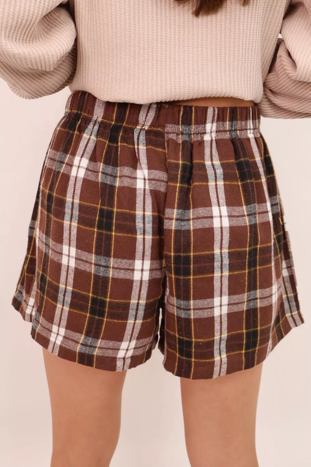 Plaid Button Front Elastic Waist Shorts designed for comfort and style at Lookzlike