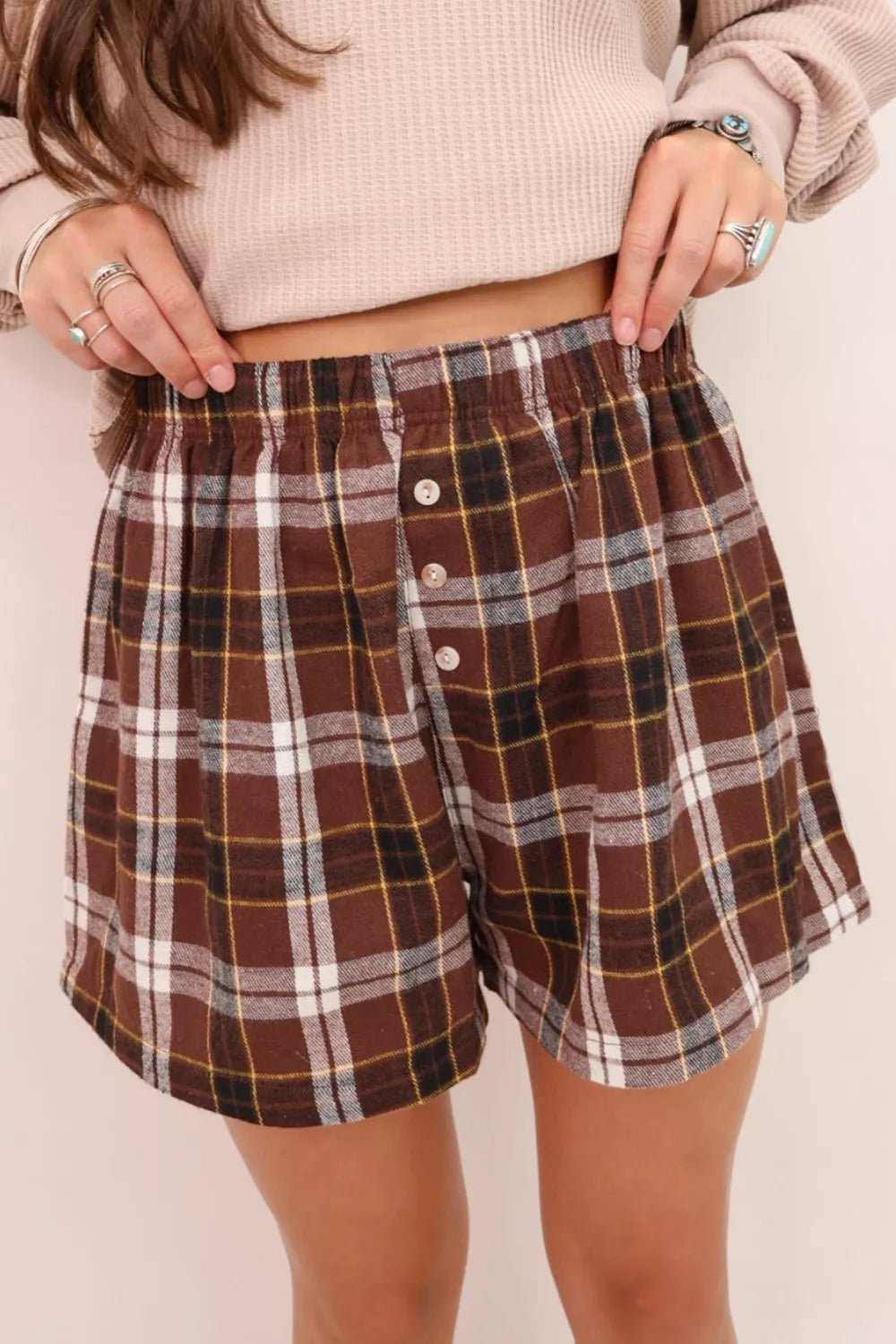 Plaid Button Front Elastic Waist Shorts designed for comfort and style at Lookzlike