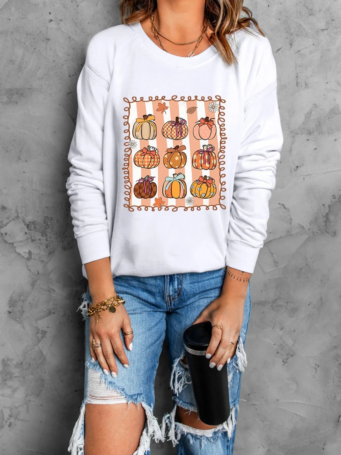 Pumpkin Graphic Round Neck Sweatshirt designed for comfort and style at Lookzlike