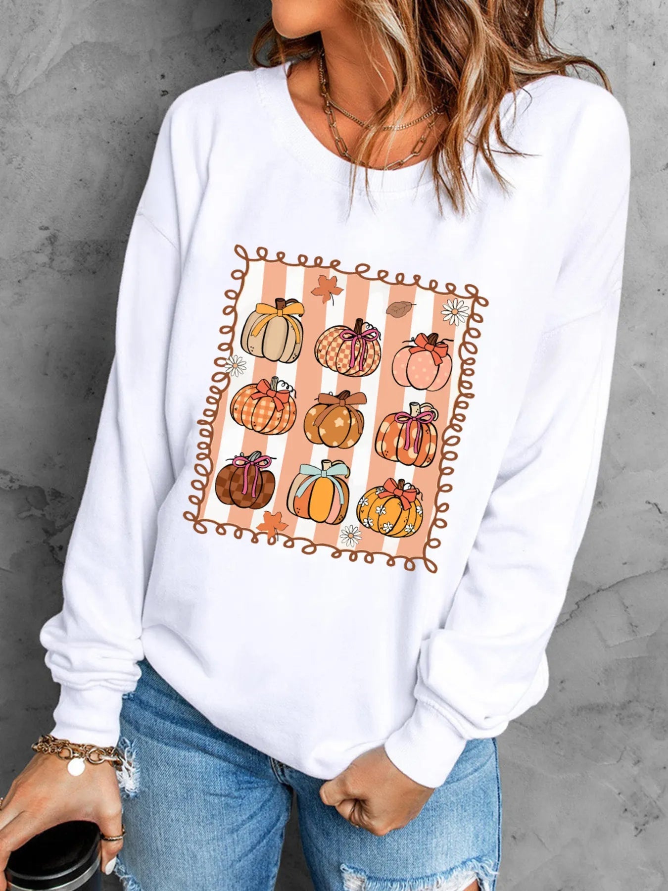 Pumpkin Graphic Round Neck Sweatshirt designed for comfort and style at Lookzlike