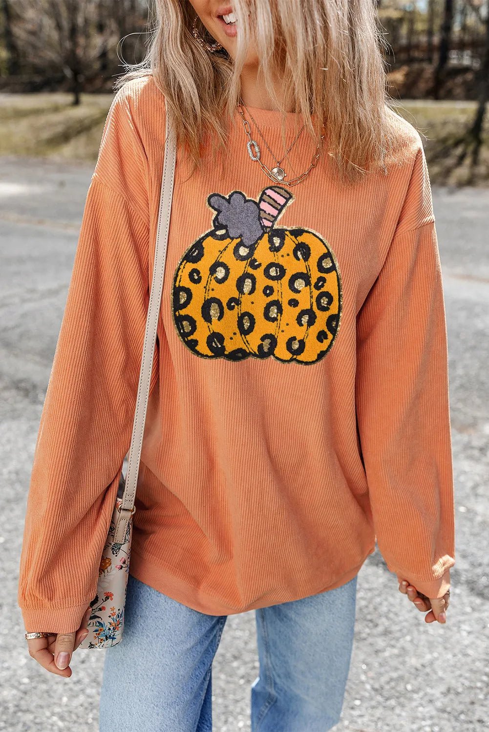 Pumpkin Round Neck Long Sleeve Sweatshirt designed for comfort and style at Lookzlike