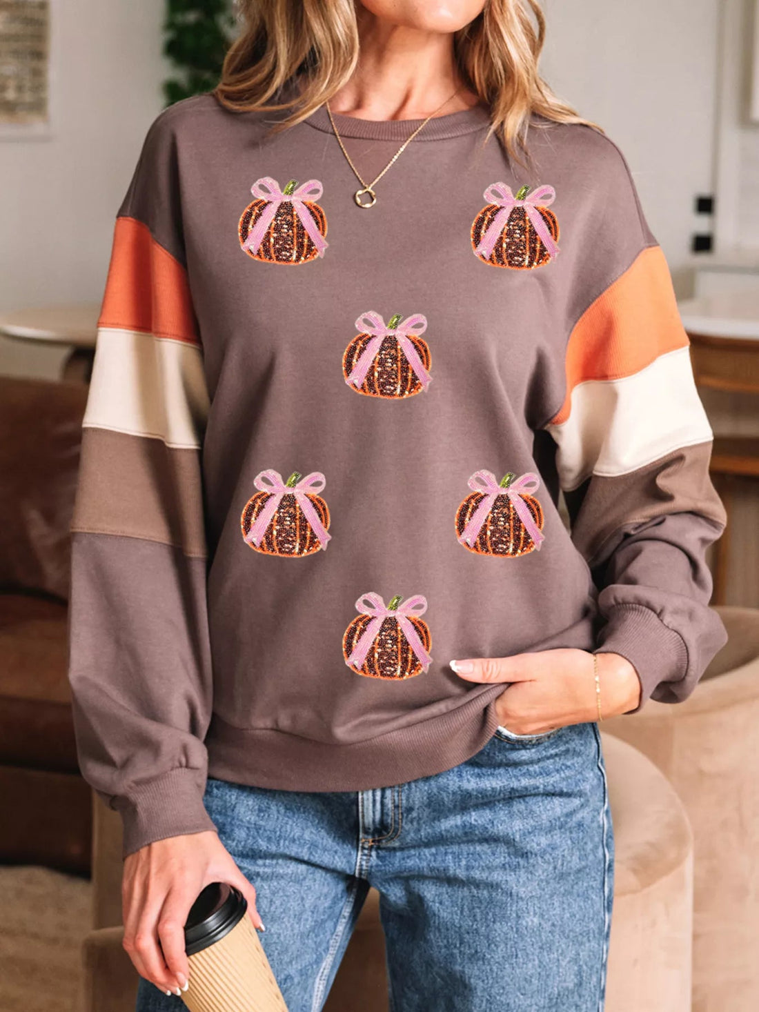 Sequin Bow Pumpkin Round Neck Sweatshirt designed for comfort and style at Lookzlike