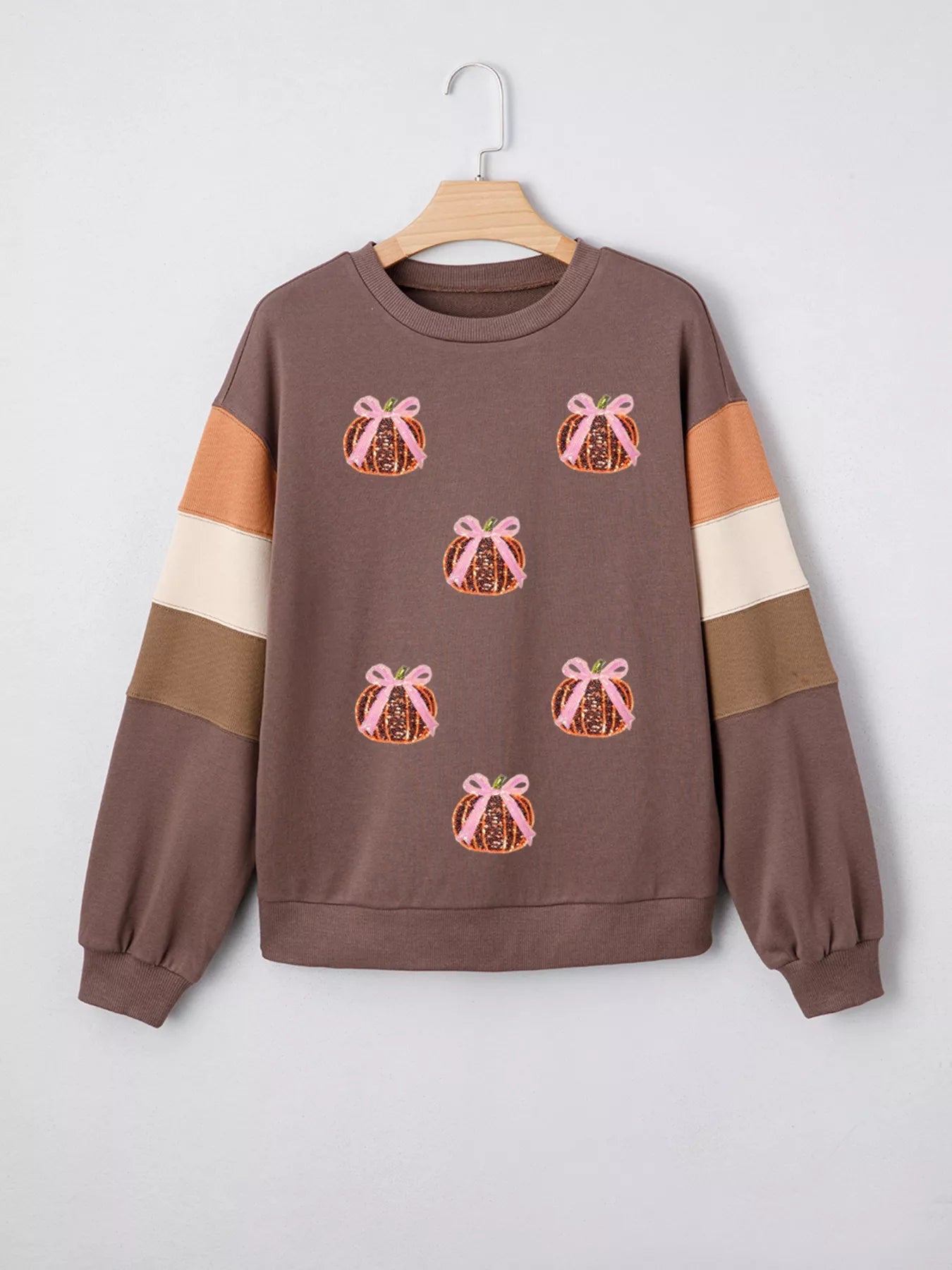 Sequin Bow Pumpkin Round Neck Sweatshirt designed for comfort and style at Lookzlike