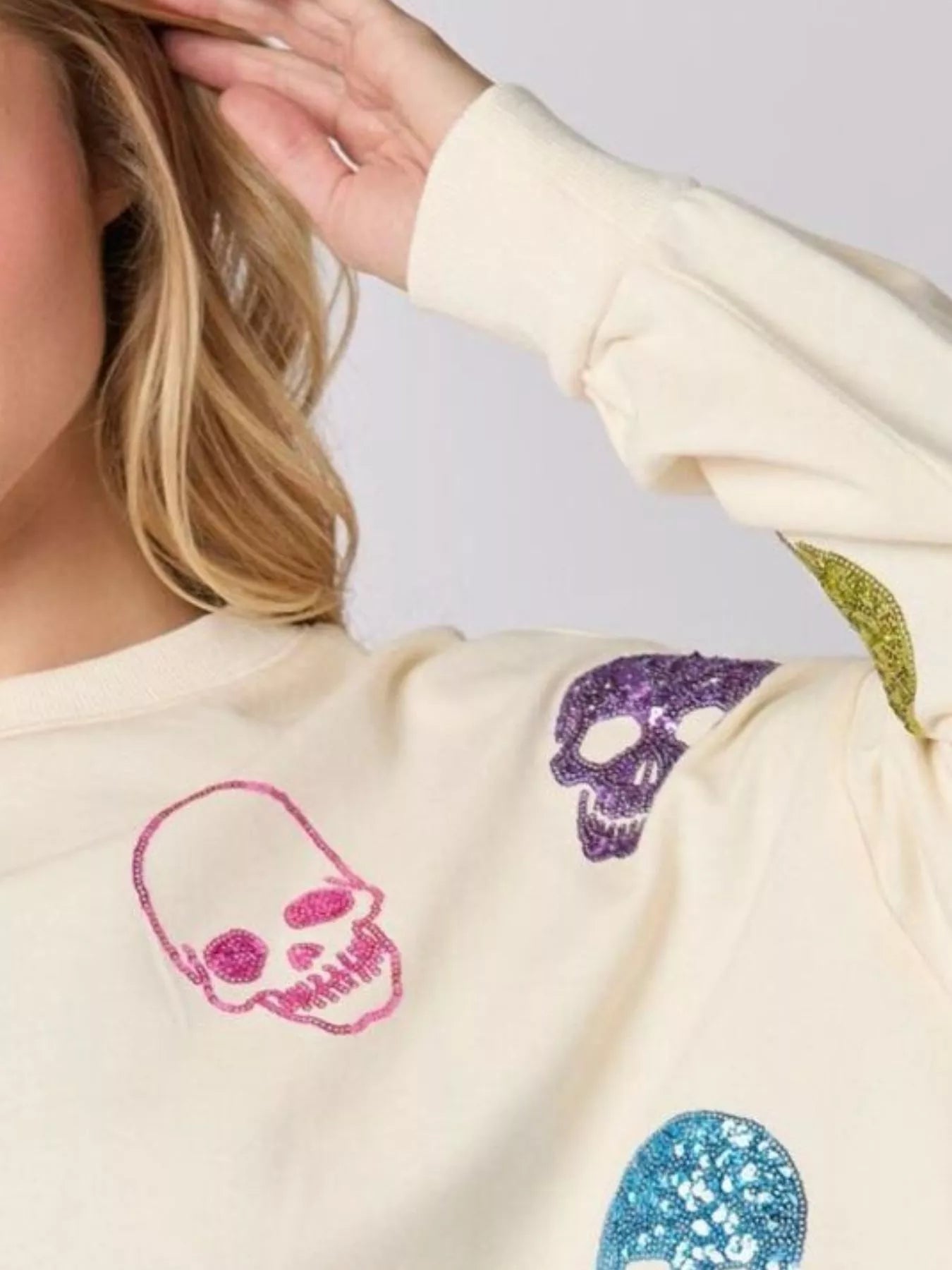 Sequin Skull Long Sleeve Sweatshirt designed for comfort and style at Lookzlike