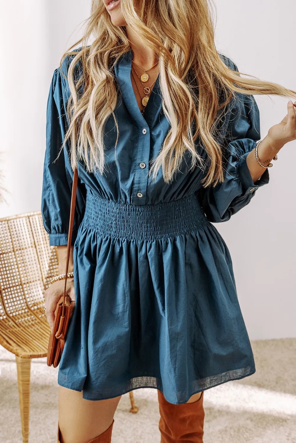 Smocked Half Button Three-Quarter Sleeve Mini Dress designed for comfort and style at Lookzlike