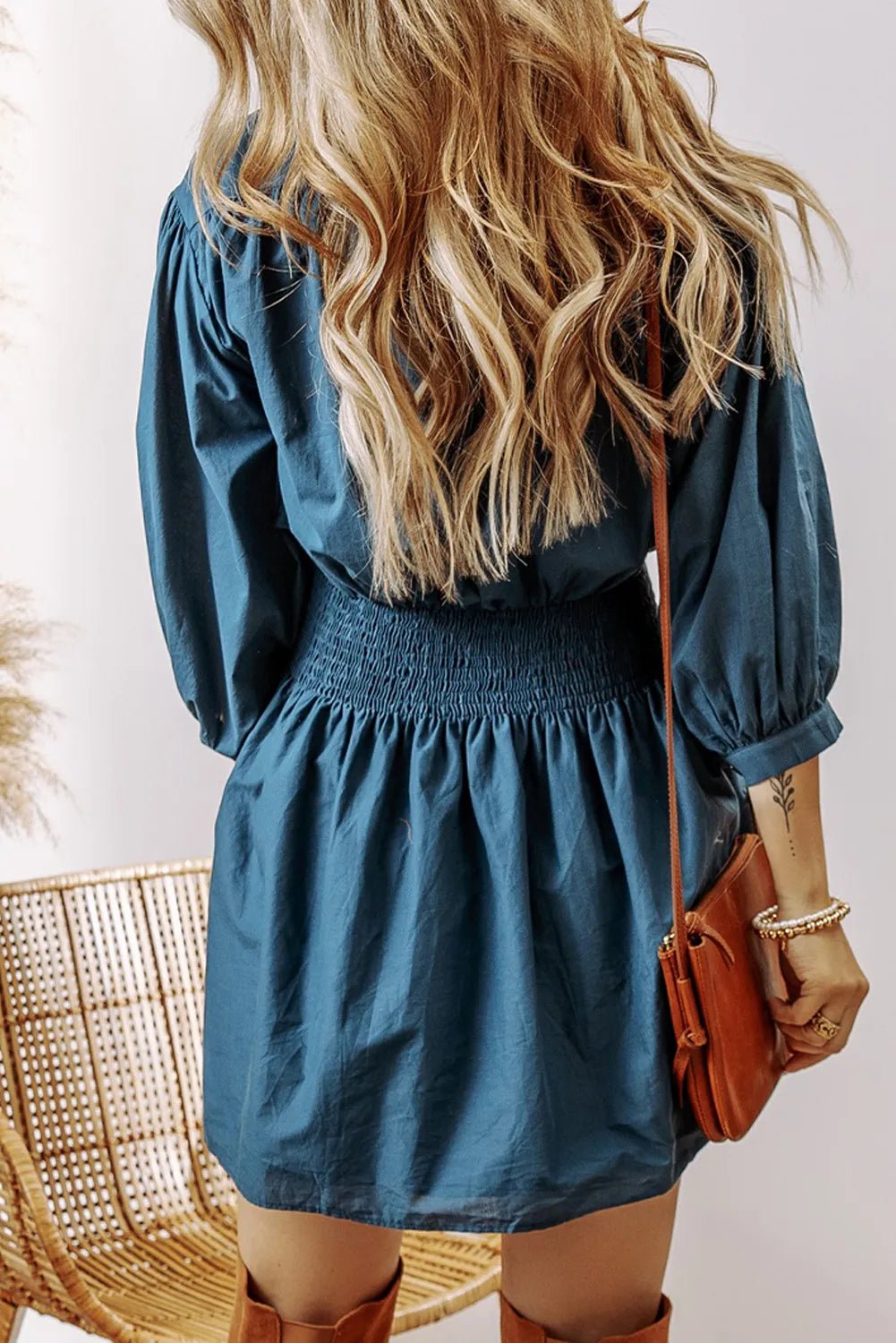 Smocked Half Button Three-Quarter Sleeve Mini Dress designed for comfort and style at Lookzlike