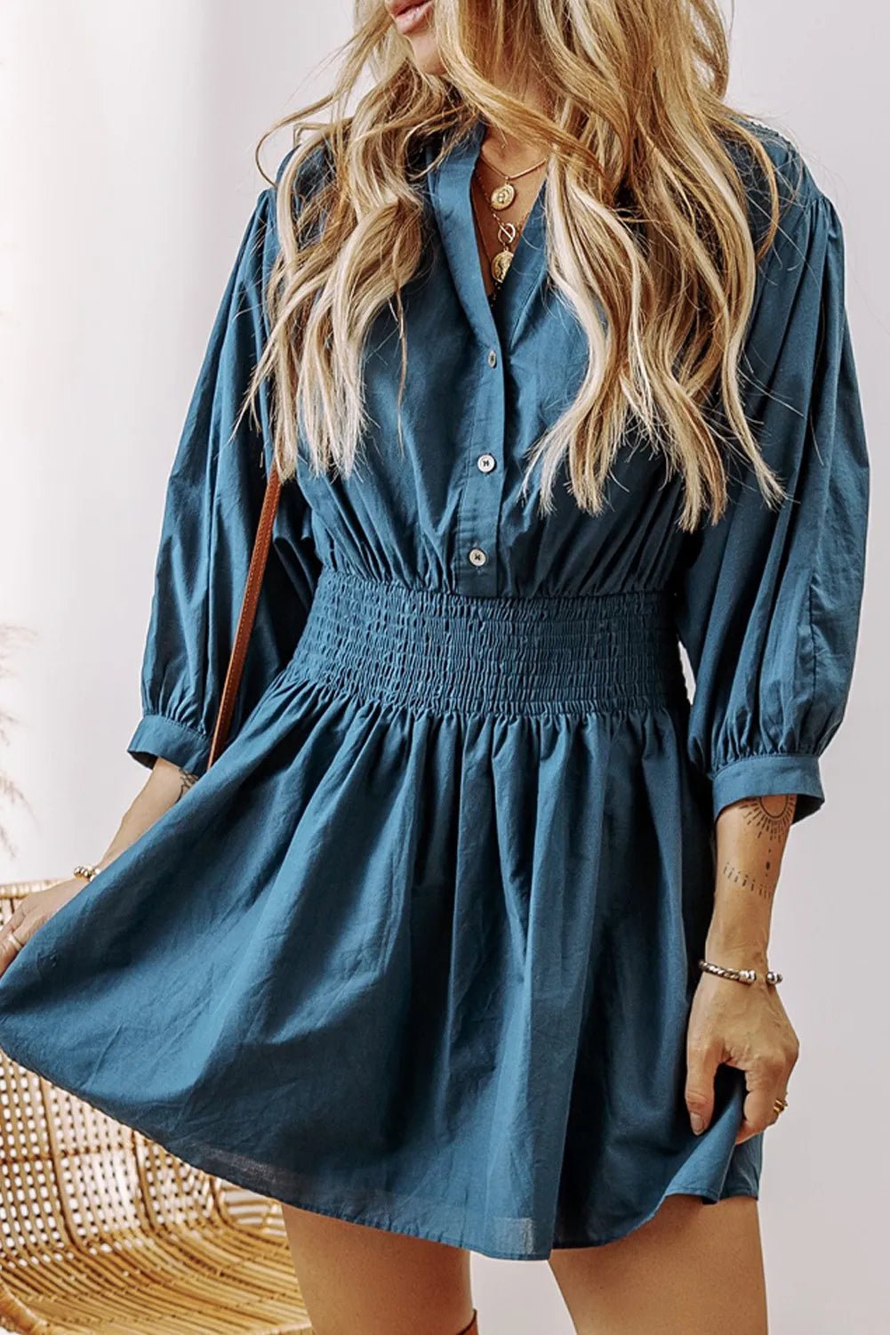 Smocked Half Button Three-Quarter Sleeve Mini Dress designed for comfort and style at Lookzlike