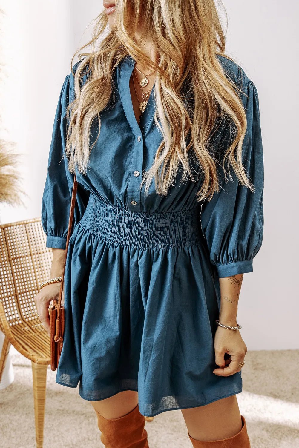 Smocked Half Button Three-Quarter Sleeve Mini Dress designed for comfort and style at Lookzlike