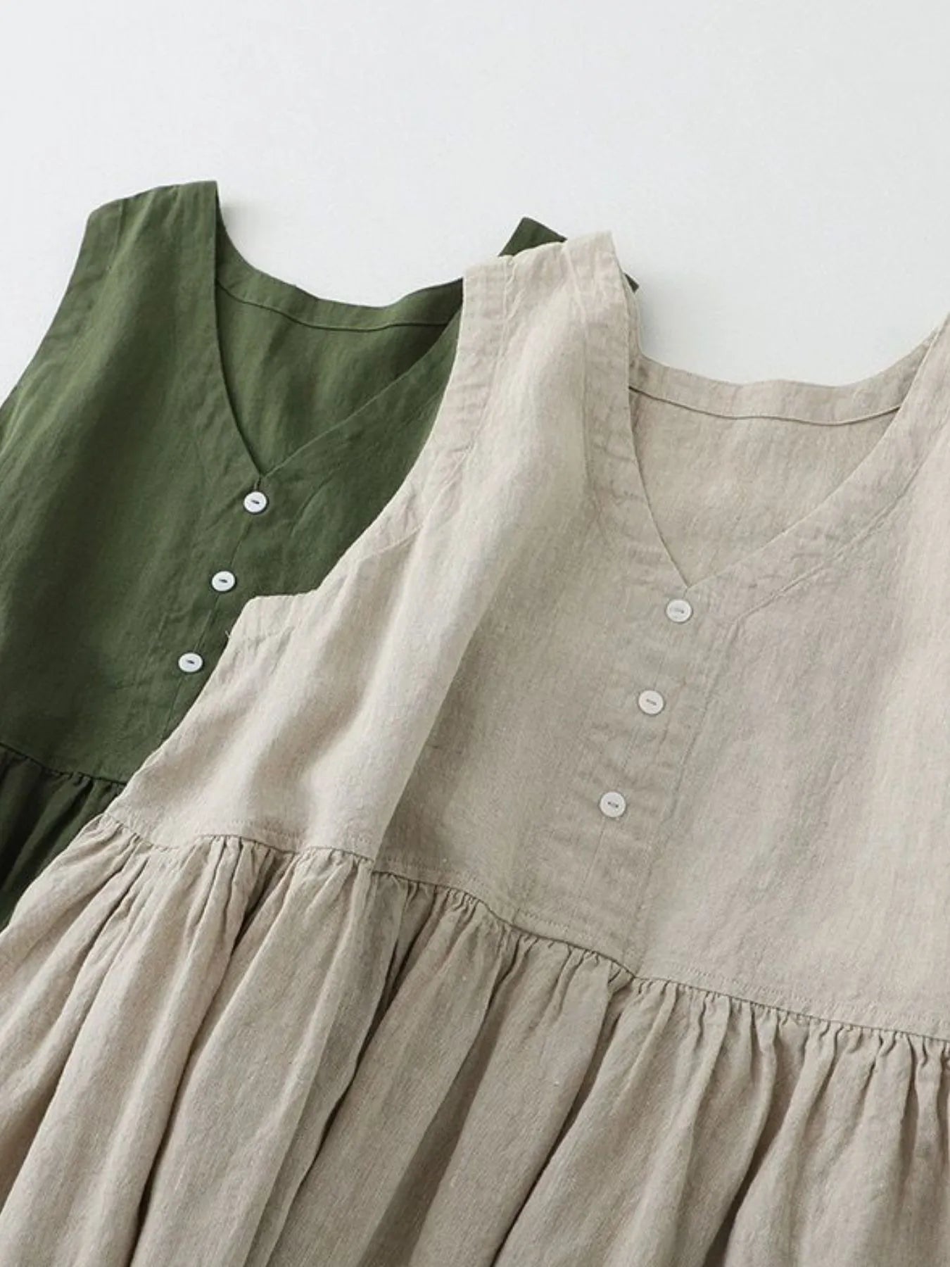 V-Neck Button Detail Sleeveless Midi Dress designed for comfort and style at Lookzlike