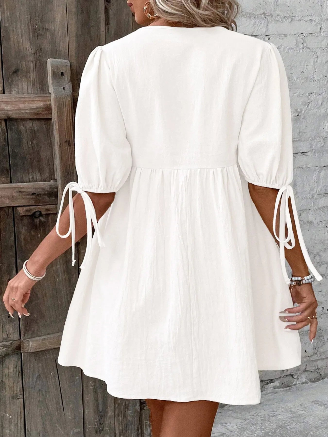 V-Neck Tie-Front Mini Dress with Puff Sleeves designed for comfort and style at Lookzlike