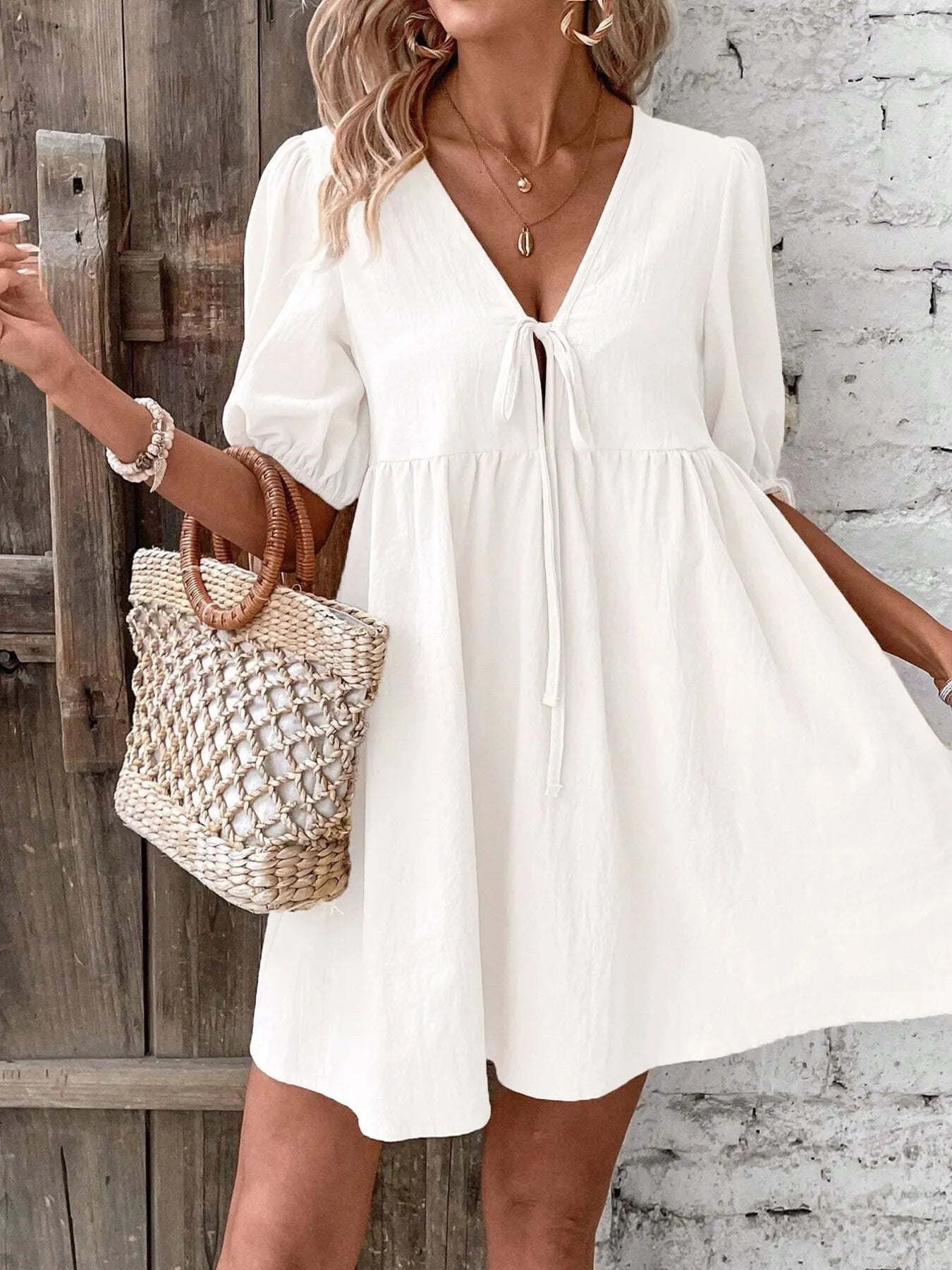V-Neck Tie-Front Mini Dress with Puff Sleeves designed for comfort and style at Lookzlike