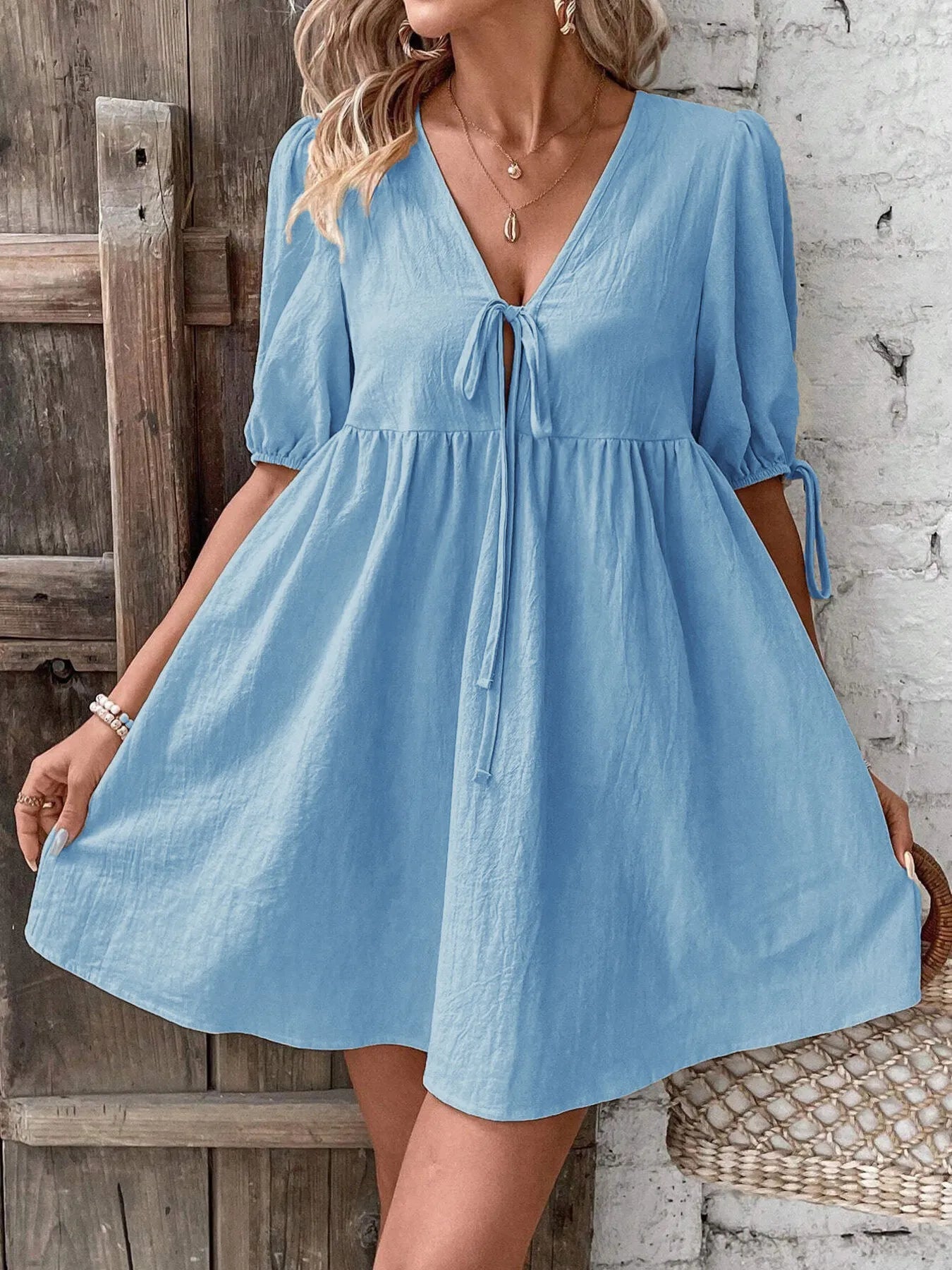 V-Neck Tie-Front Mini Dress with Puff Sleeves designed for comfort and style at Lookzlike