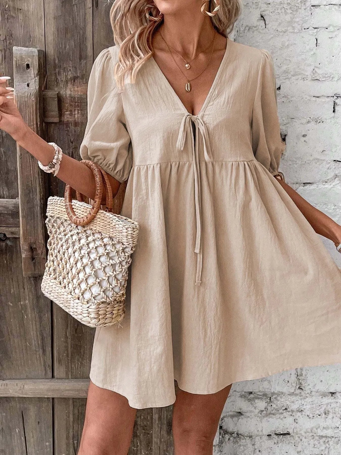 V-Neck Tie-Front Mini Dress with Puff Sleeves designed for comfort and style at Lookzlike