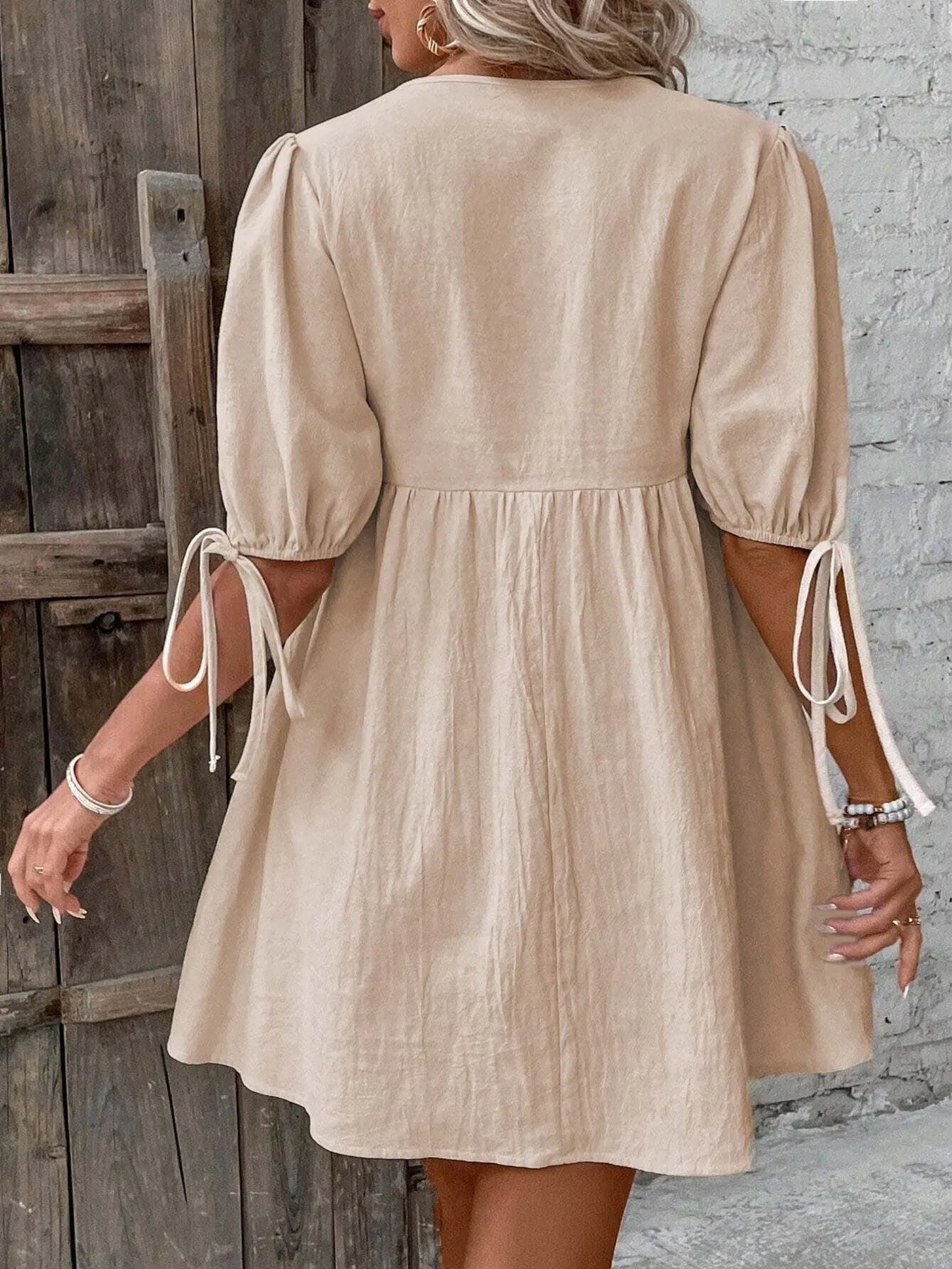 V-Neck Tie-Front Mini Dress with Puff Sleeves designed for comfort and style at Lookzlike