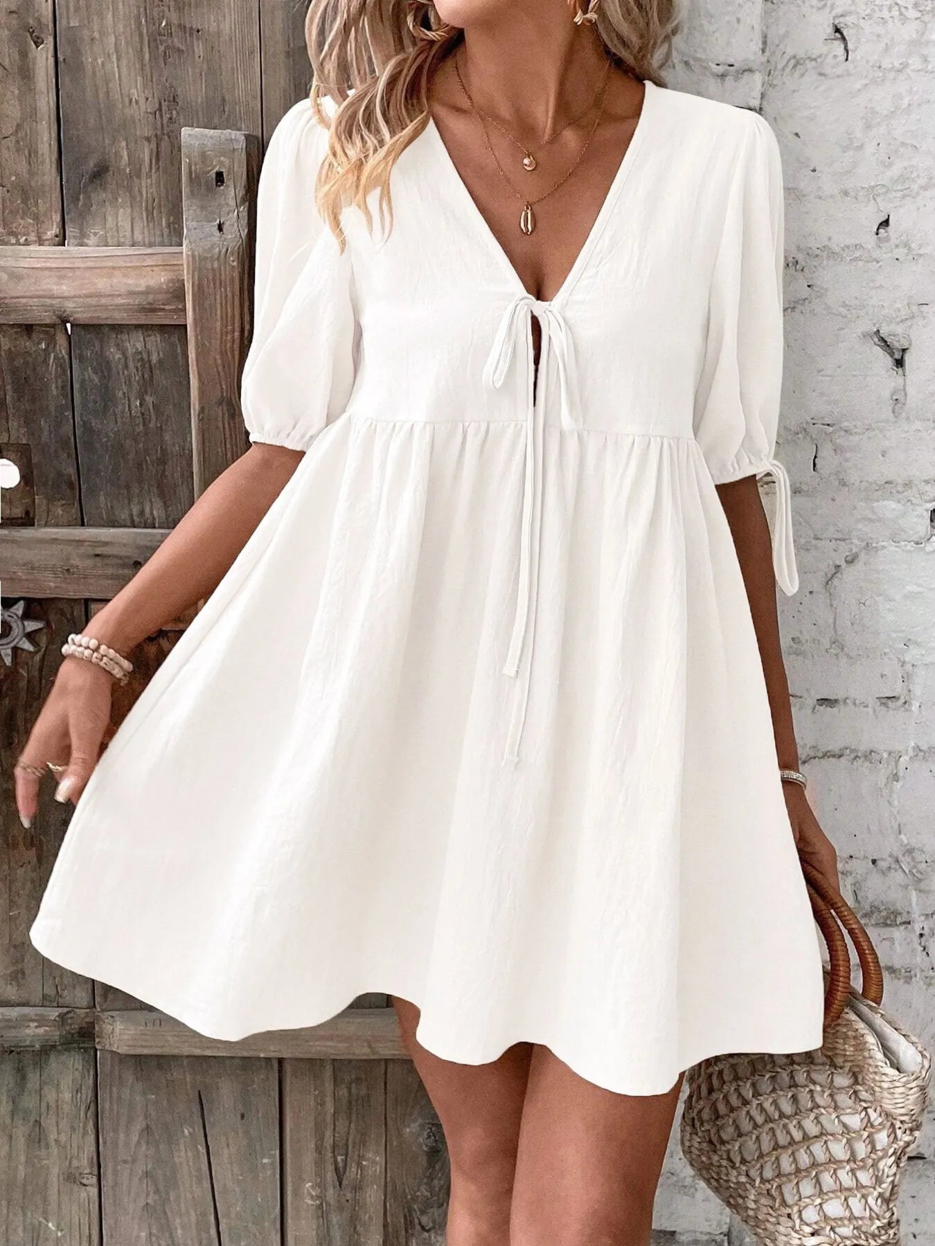 V-Neck Tie-Front Mini Dress with Puff Sleeves designed for comfort and style at Lookzlike