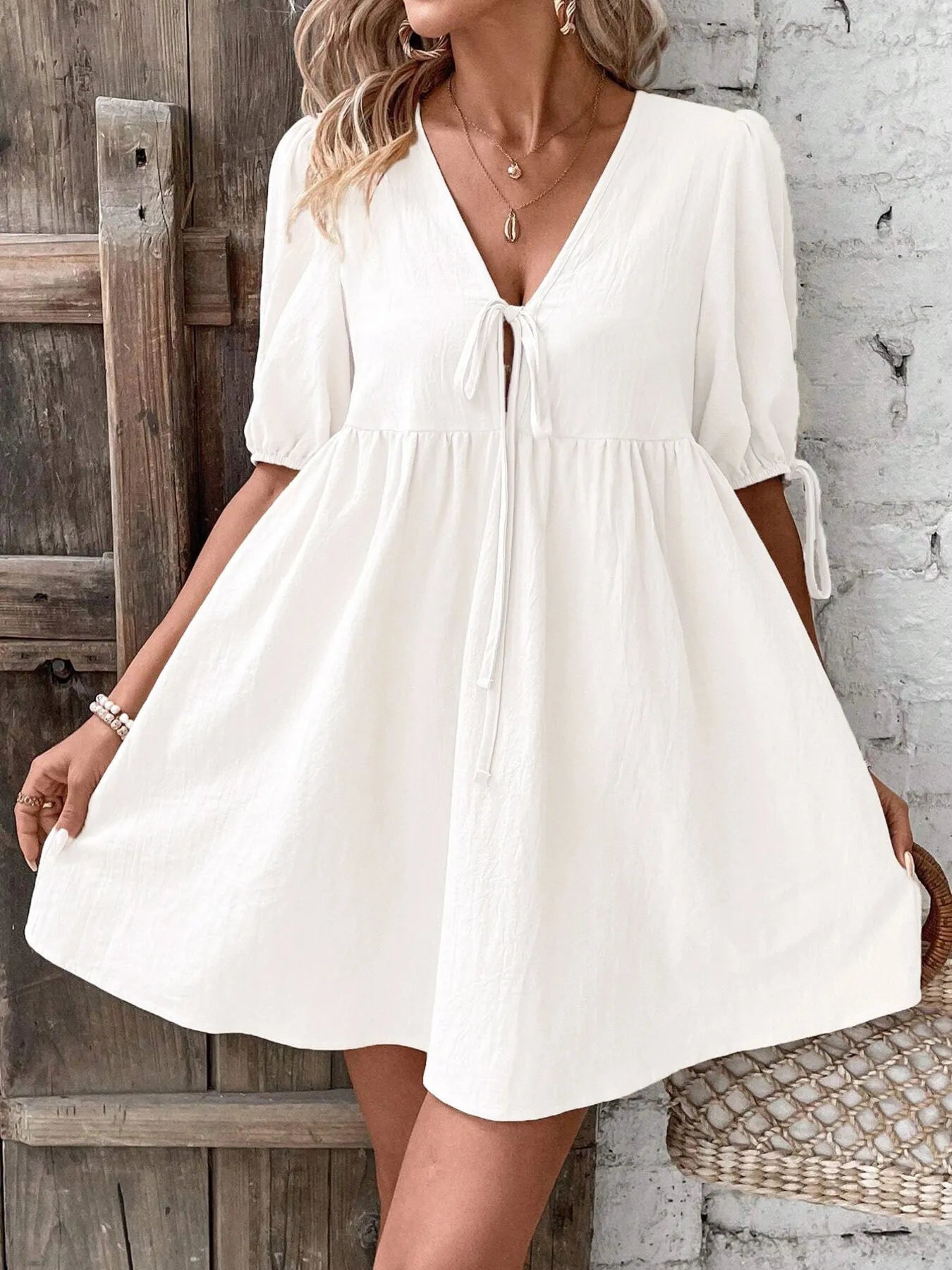 V-Neck Tie-Front Mini Dress with Puff Sleeves designed for comfort and style at Lookzlike