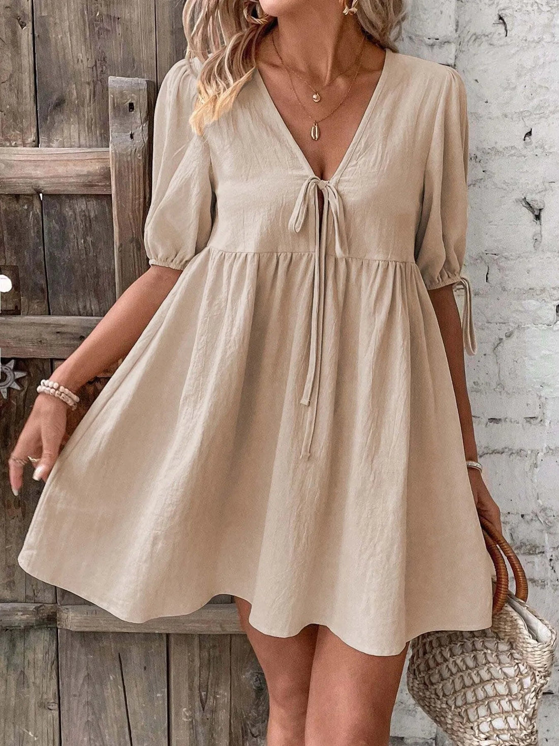 V-Neck Tie-Front Mini Dress with Puff Sleeves designed for comfort and style at Lookzlike