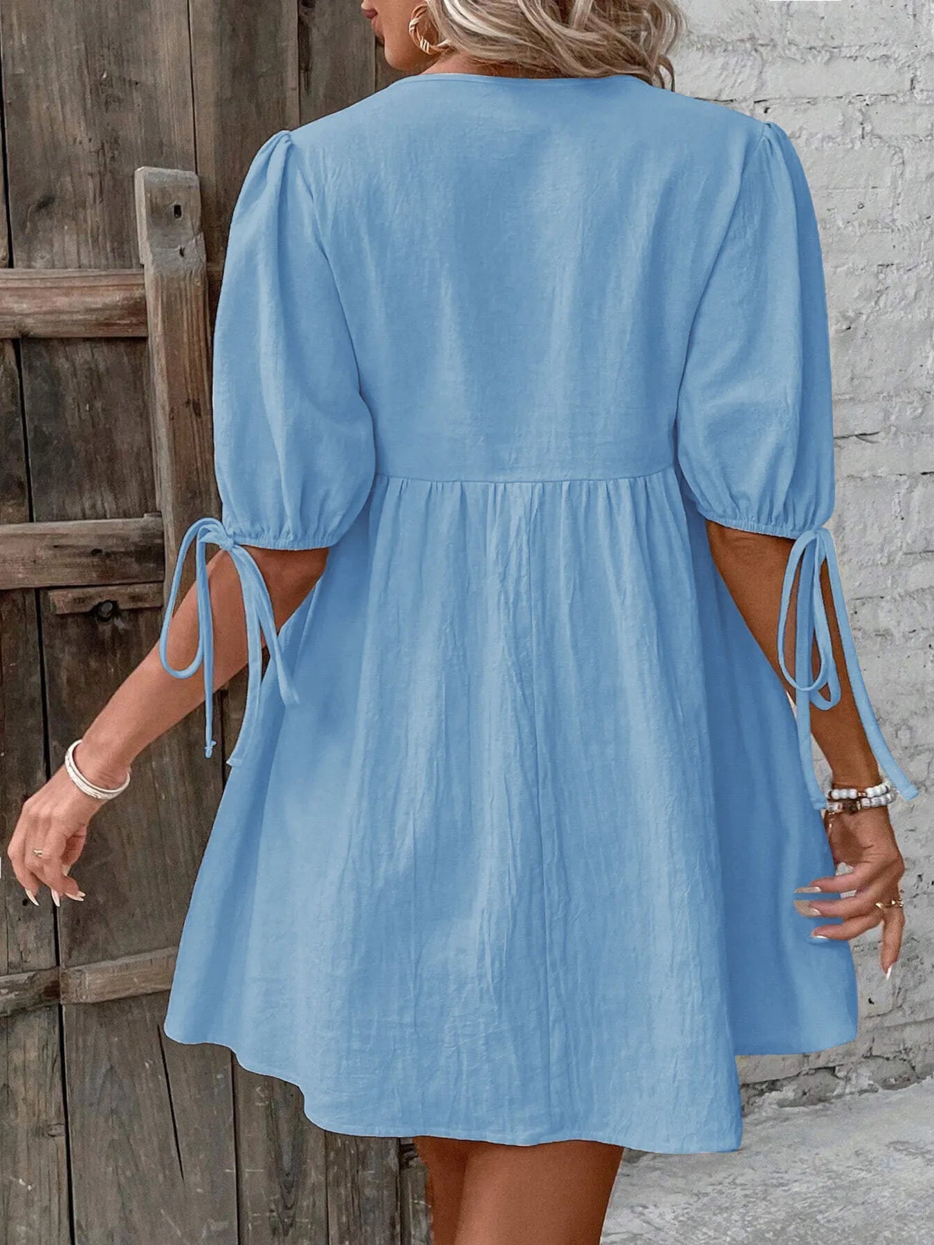 V-Neck Tie-Front Mini Dress with Puff Sleeves designed for comfort and style at Lookzlike