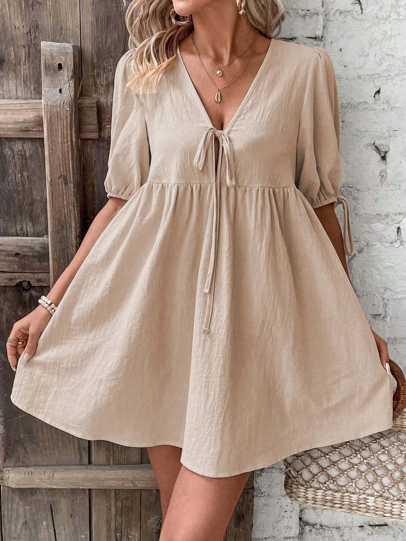 V-Neck Tie-Front Mini Dress with Puff Sleeves designed for comfort and style at Lookzlike