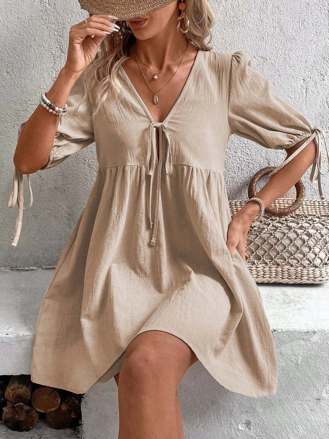V-Neck Tie-Front Mini Dress with Puff Sleeves designed for comfort and style at Lookzlike