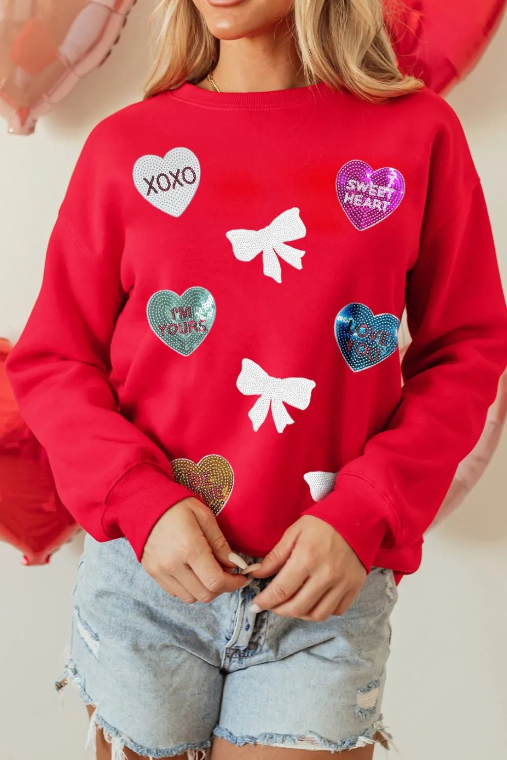 Valentine’s Day Sequin Bow Heart Round Neck Sweatshirt designed for comfort and style at Lookzlike