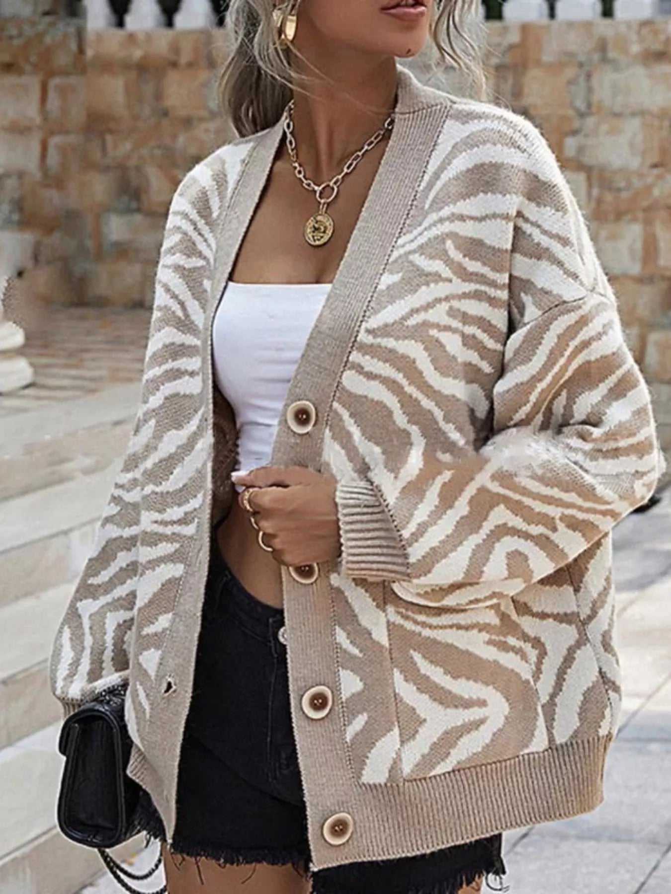 Zebra Print Button Up Cardigan designed for comfort and style at Lookzlike
