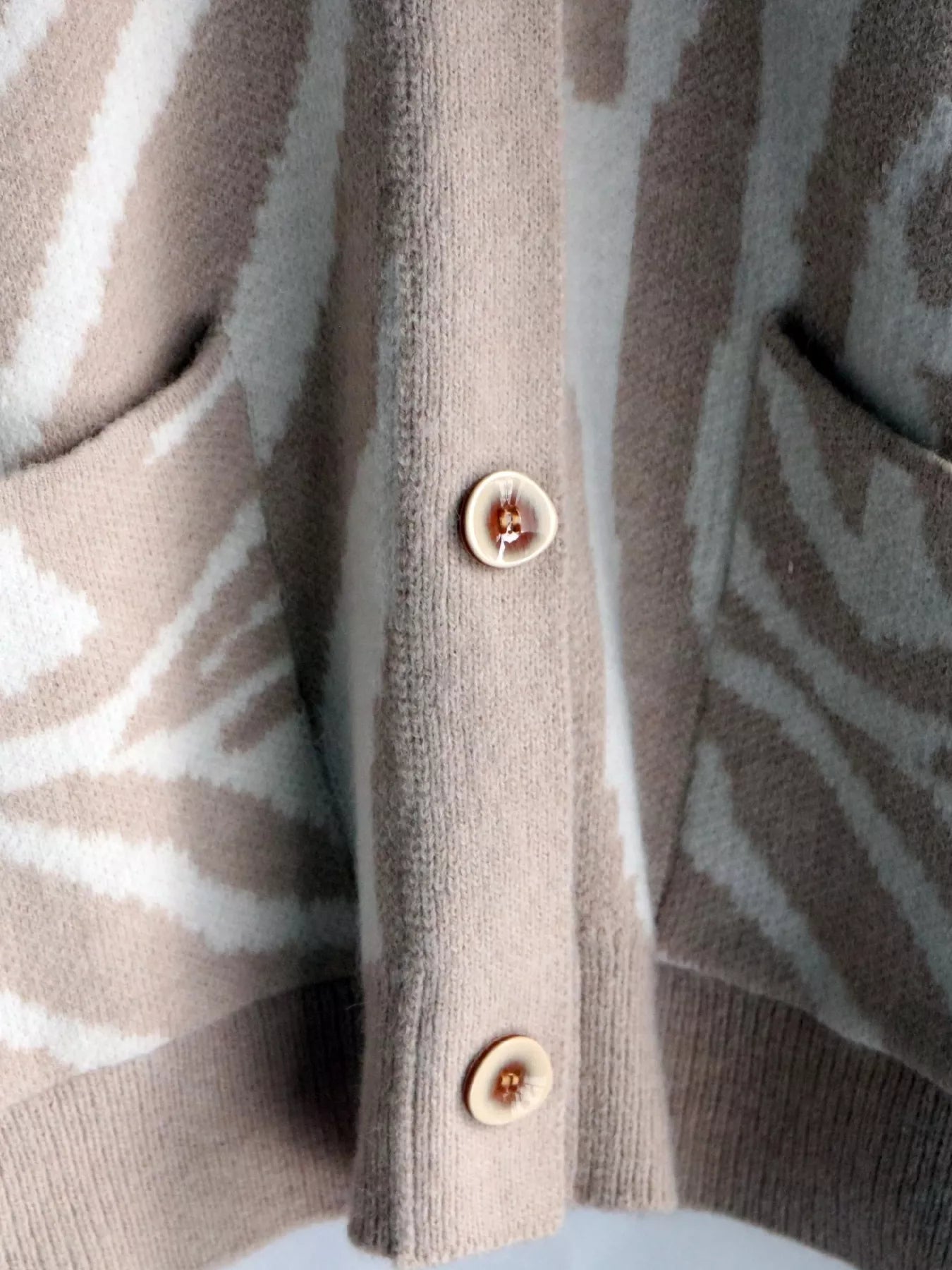 Zebra Print Button Up Cardigan designed for comfort and style at Lookzlike