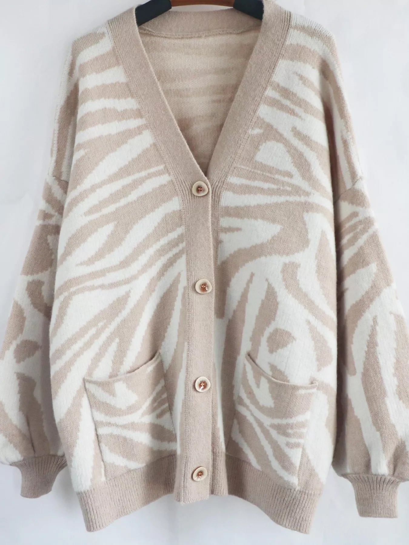 Zebra Print Button Up Cardigan designed for comfort and style at Lookzlike